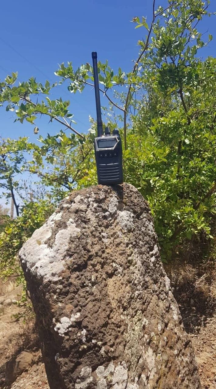 Park rangers using radio communication equipment during patrol operations